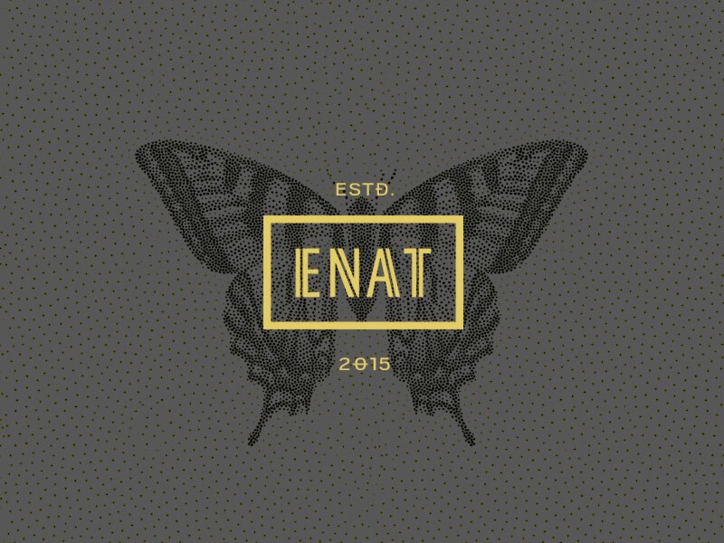 ENAT butterfly mark, ESTD 2015, on a dark dotted ground